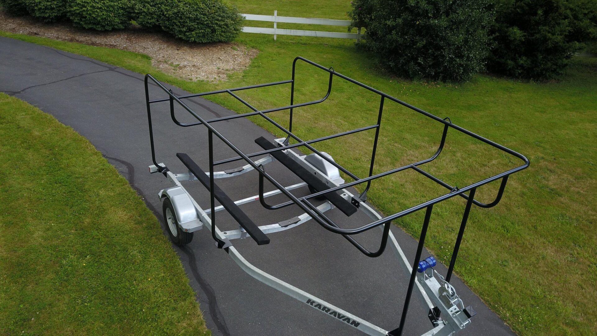 A trailer with a rack on the side of it.