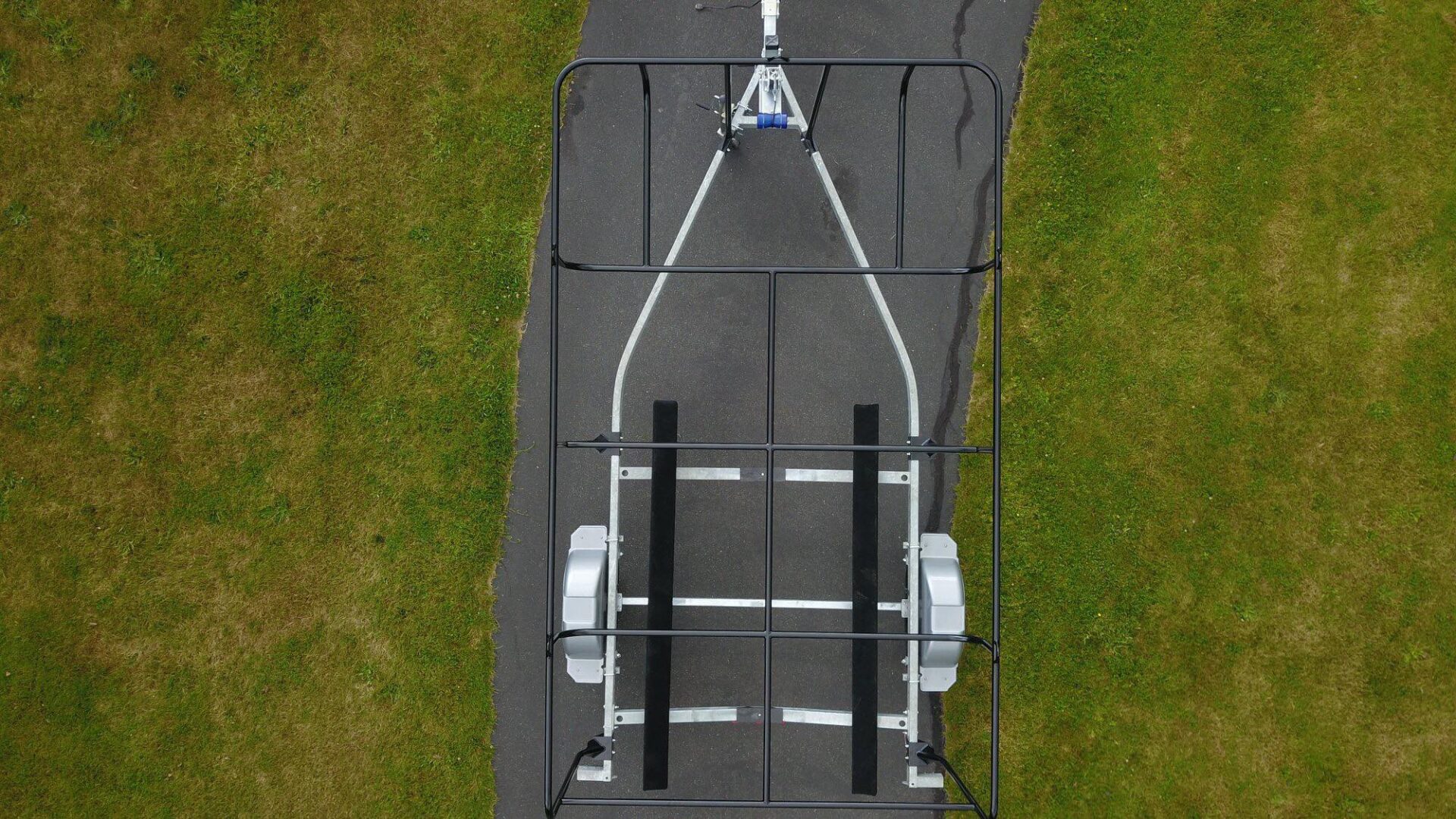 A view of the back end of a boat trailer.