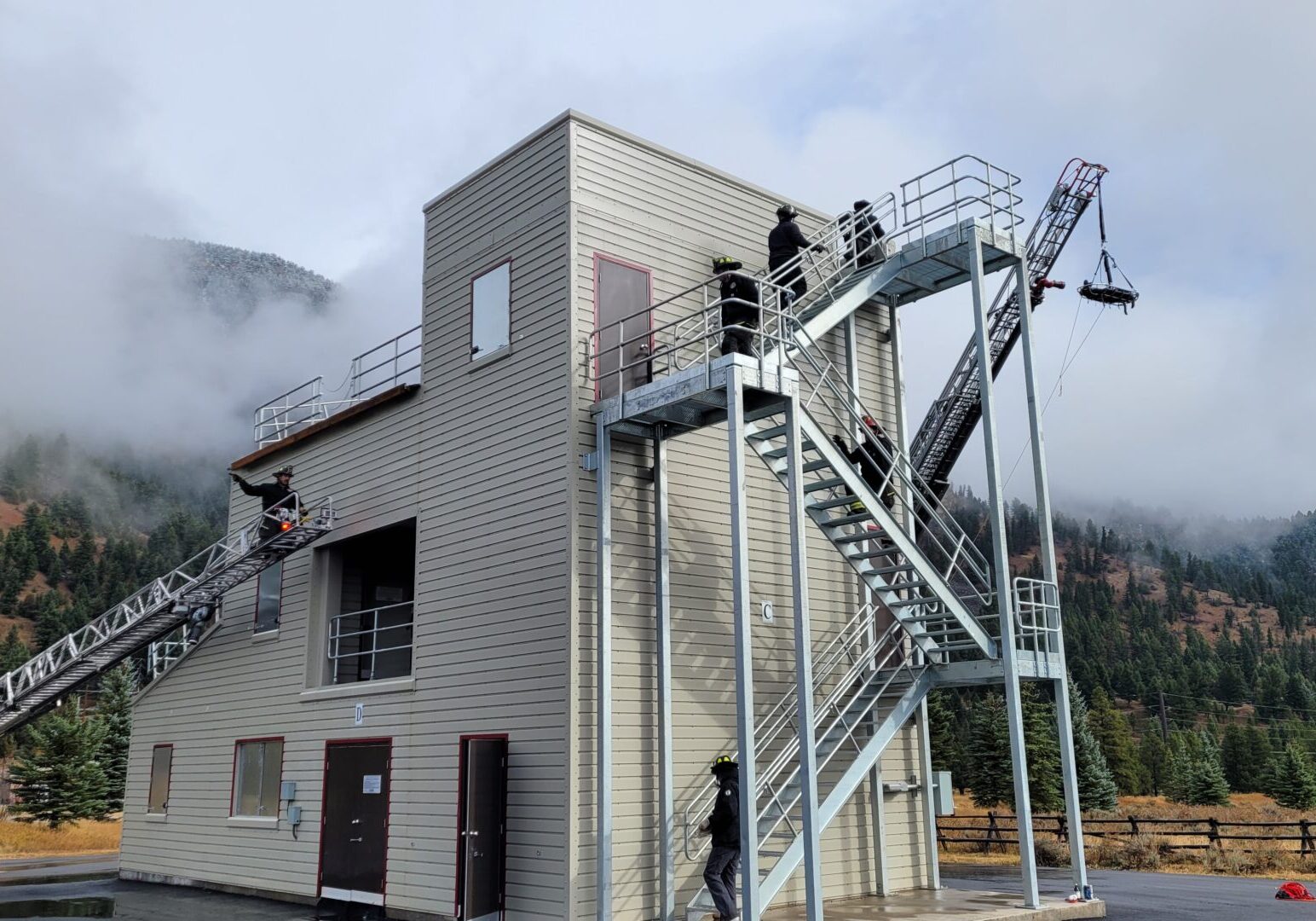 A building with stairs going up to the top of it.